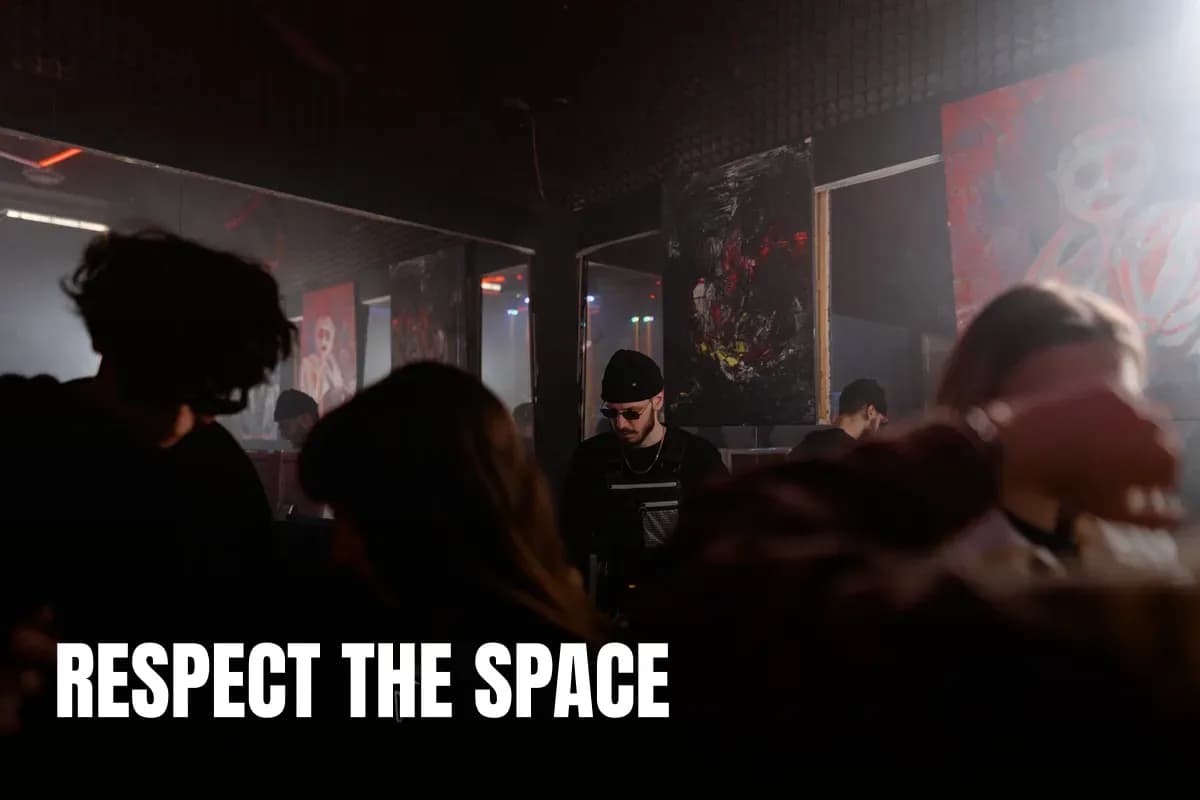 Energetic nightclub scene with a DJ and dynamic dancing crowd under moody lights.