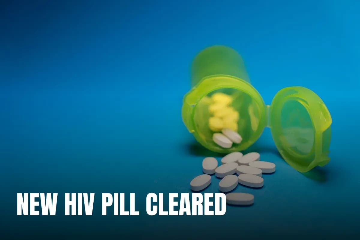 Image of a green pill bottle with white tablets scattered on a blue background, symbolizing healthcare and medication.