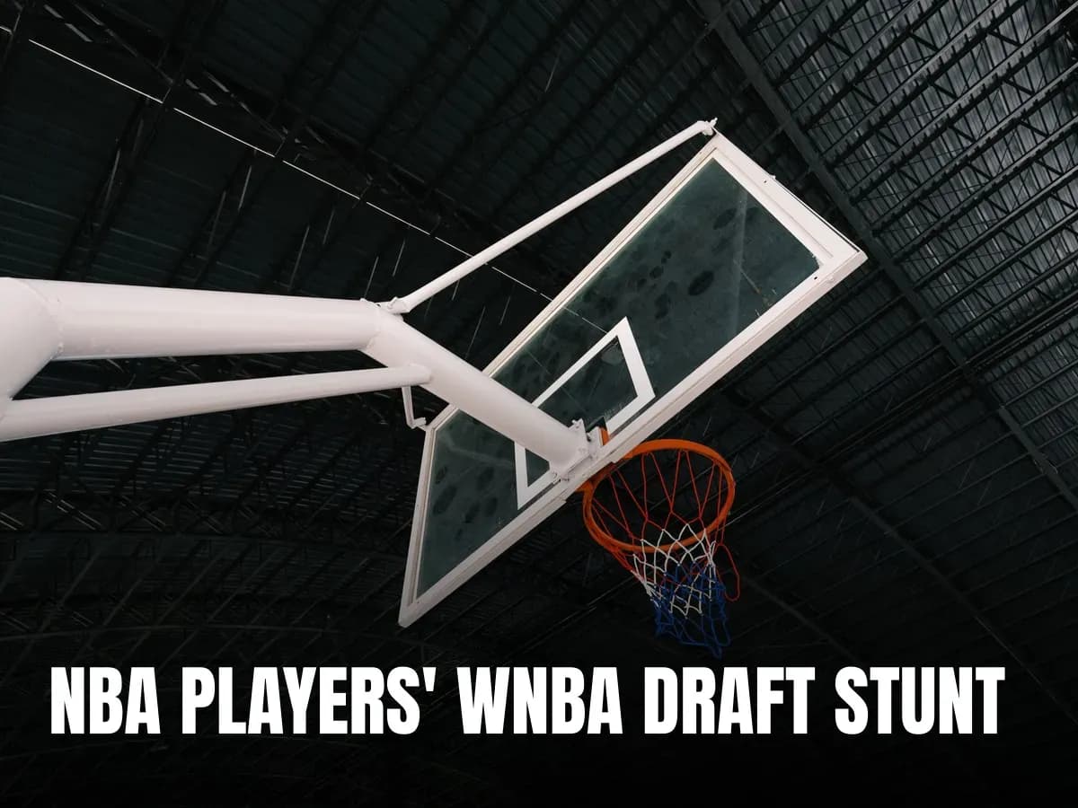 Close-up of an indoor basketball hoop and backboard in an empty sports hall.