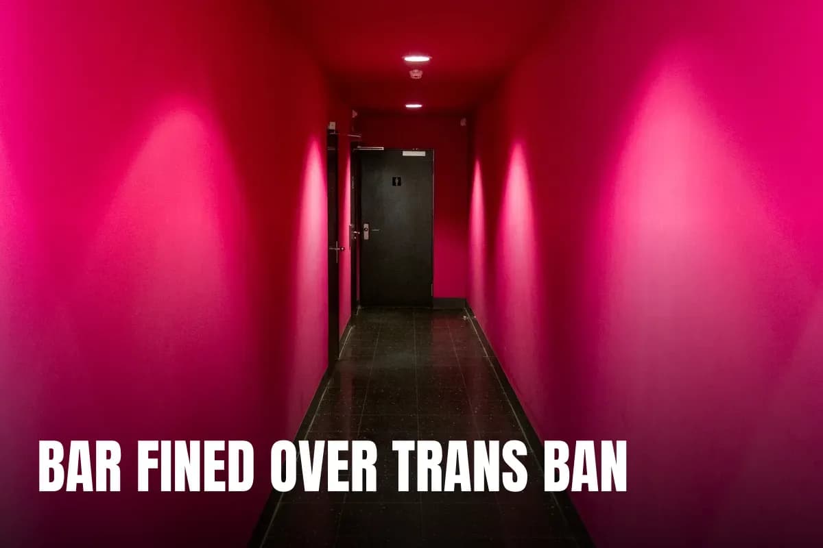 Modern hallway with bold pink walls and a black door, showcasing a strong perspective view.