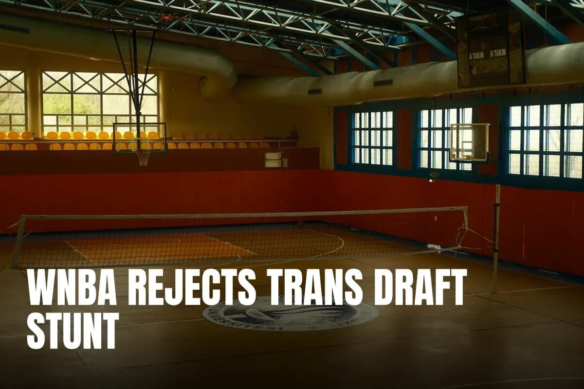 Spacious gym with volleyball net and basketball hoop, ideal for sports activities.