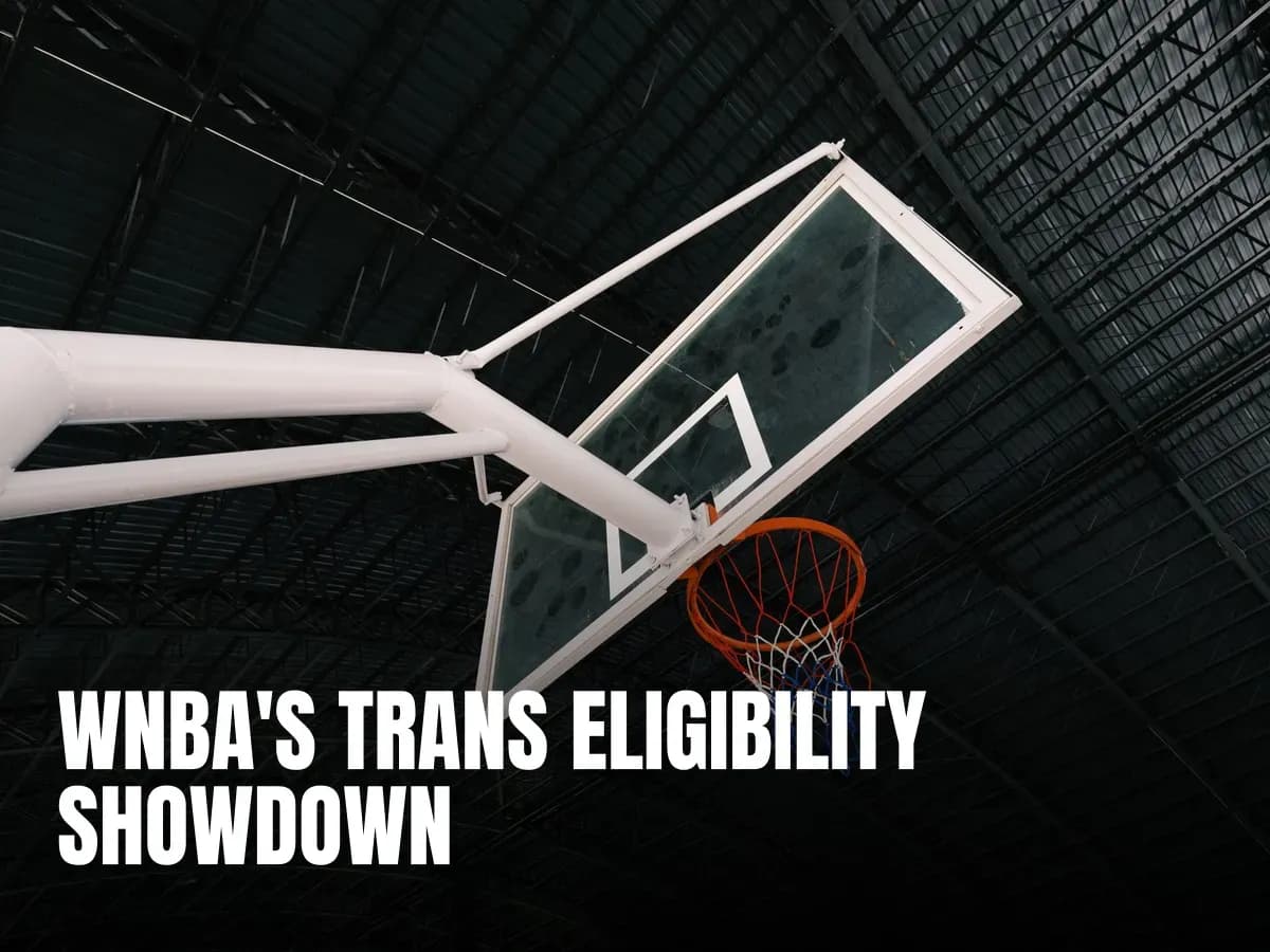Close-up of an indoor basketball hoop and backboard in an empty sports hall.