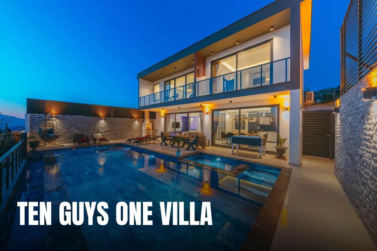 Modern luxury villa at dusk with an illuminated swimming pool and elegant terraces.