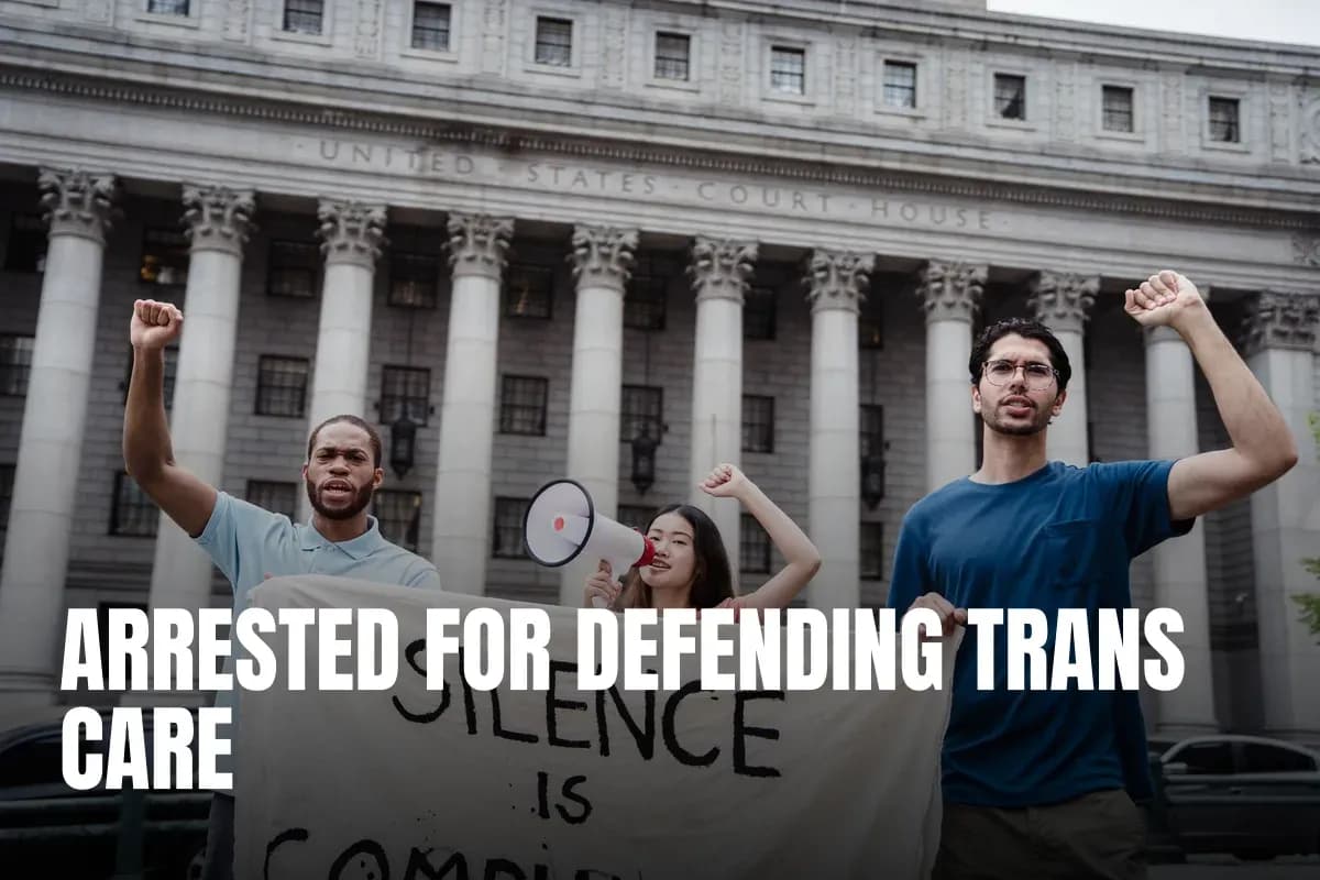 Group of diverse activists holding banner and megaphone in front of a US courthouse for a protest.