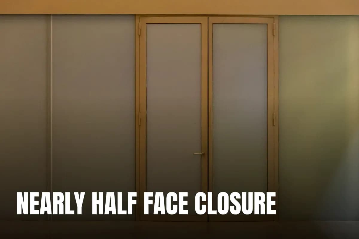 A minimalist beige door with frosted glass panels creating a modern aesthetic in an indoor setting.